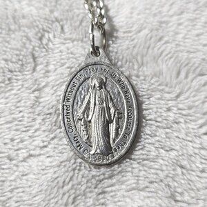 Silver tone necklace religious